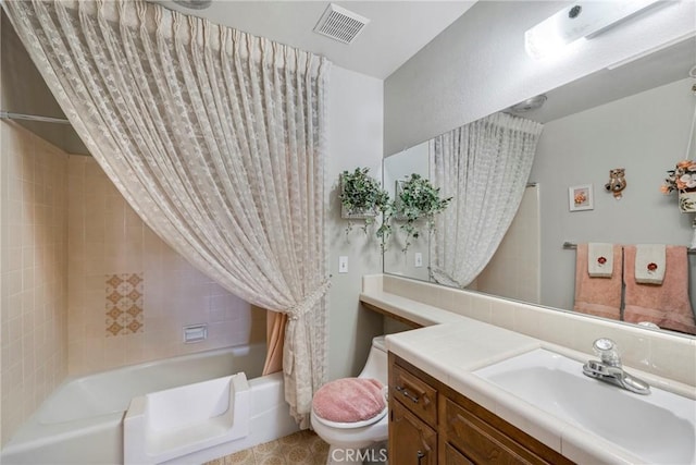 bathroom with vanity, toilet, visible vents, and shower / bath combo with shower curtain