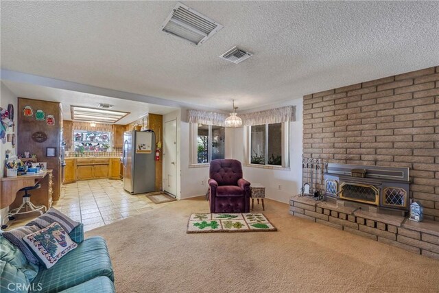 living room with light colored carpet and a textured ceiling