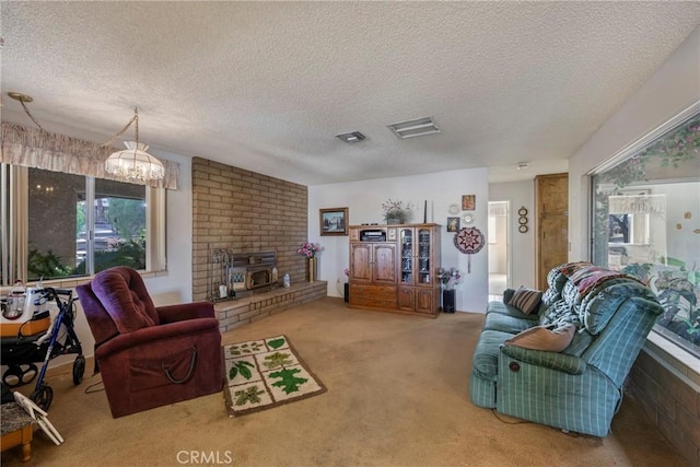 living room featuring a textured ceiling, visible vents, and carpet flooring