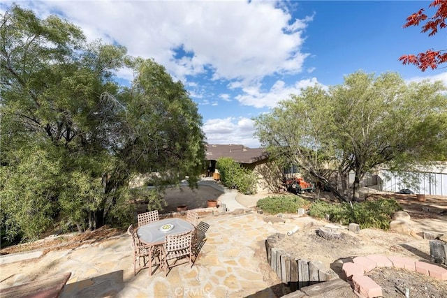 view of patio / terrace featuring fence and outdoor dining space