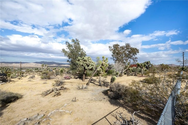 view of local wilderness featuring a mountain view and a rural view