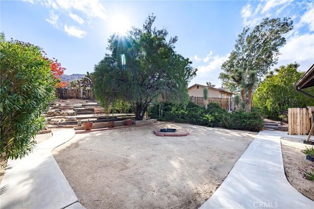 view of patio with an outdoor fire pit