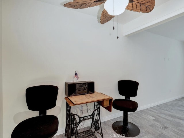 office area featuring light hardwood / wood-style floors and ceiling fan