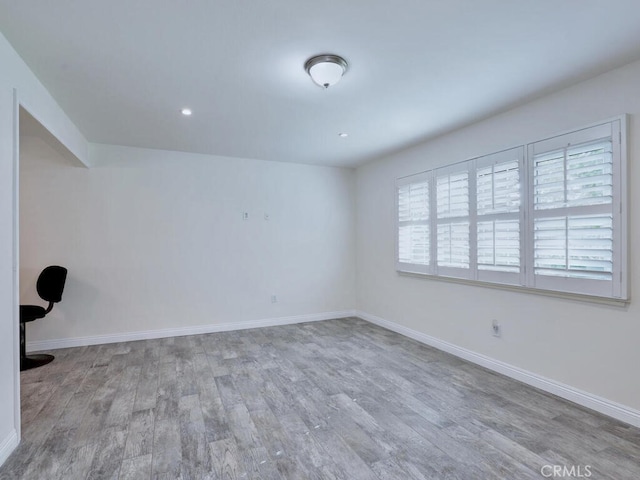 unfurnished room with light hardwood / wood-style flooring