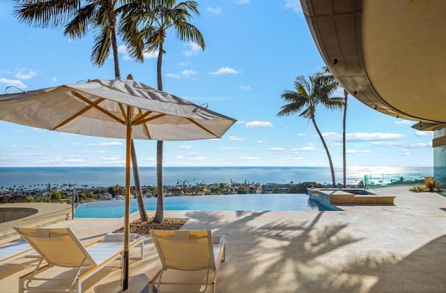 view of pool featuring a water view