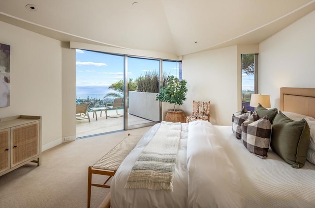 carpeted bedroom with access to exterior and high vaulted ceiling