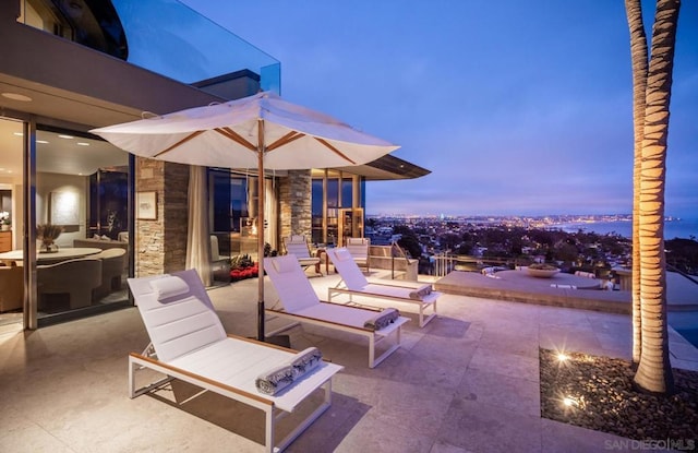 patio terrace at dusk with an outdoor fire pit