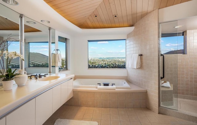 bathroom with independent shower and bath, vanity, tile patterned flooring, and wood ceiling