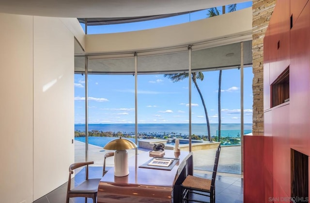 dining room featuring a water view