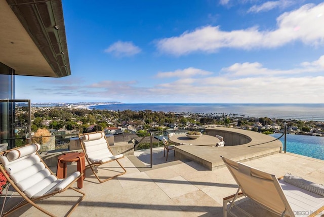 balcony featuring a patio and a water view