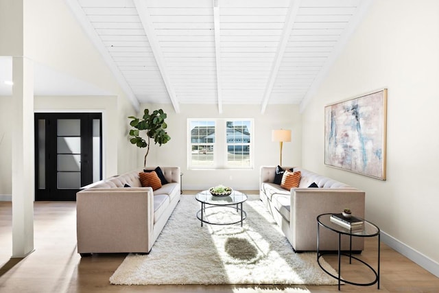 living room featuring vaulted ceiling with beams, wood ceiling, and hardwood / wood-style floors