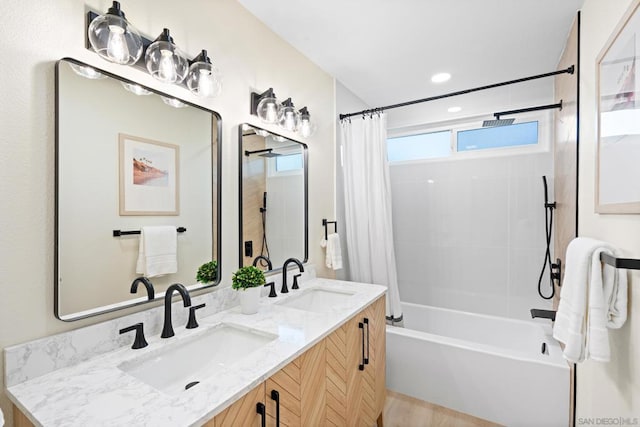 bathroom featuring vanity and shower / bath combo with shower curtain