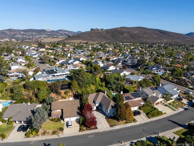 birds eye view of property with a mountain view