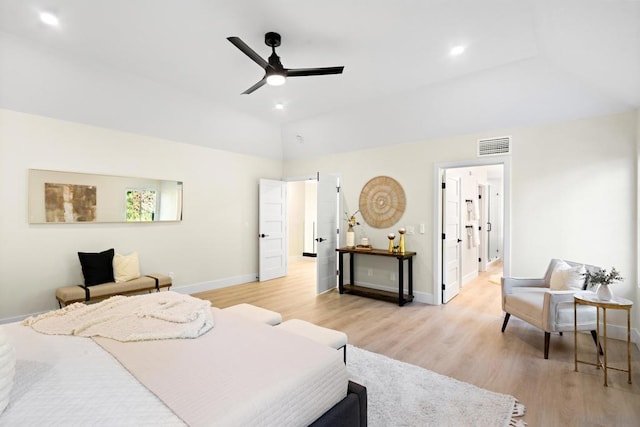 bedroom with lofted ceiling, ceiling fan, and light hardwood / wood-style flooring