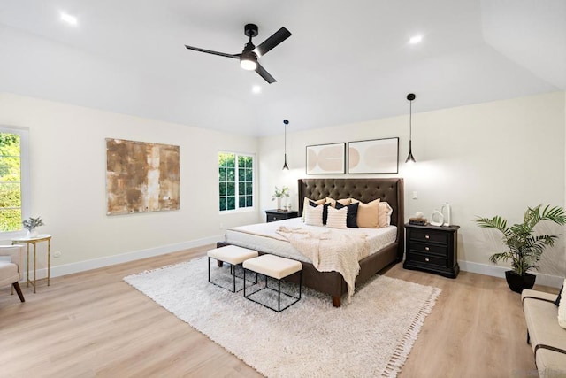 bedroom with ceiling fan and light hardwood / wood-style flooring