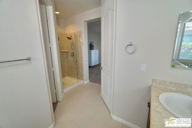 bathroom with vanity and a shower with shower door