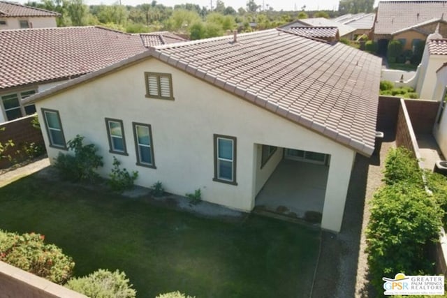 rear view of house with a yard