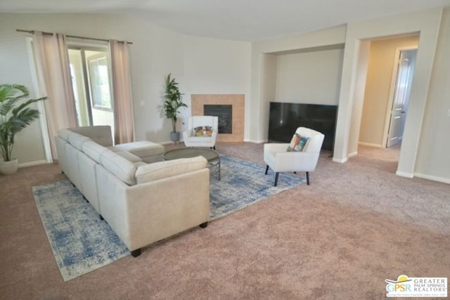 carpeted living room with lofted ceiling