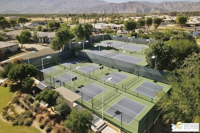 birds eye view of property with a mountain view