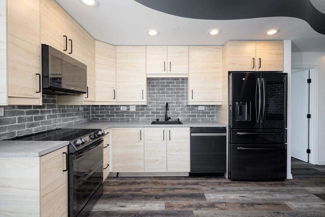 kitchen with black appliances, dark wood-type flooring, light brown cabinetry, sink, and tasteful backsplash