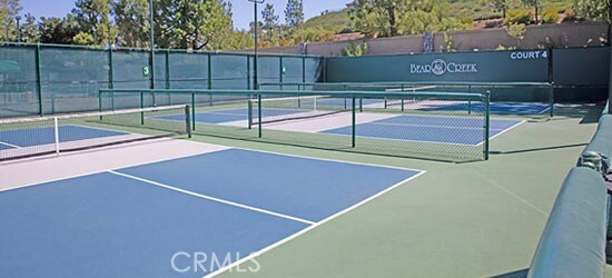 view of sport court featuring basketball hoop