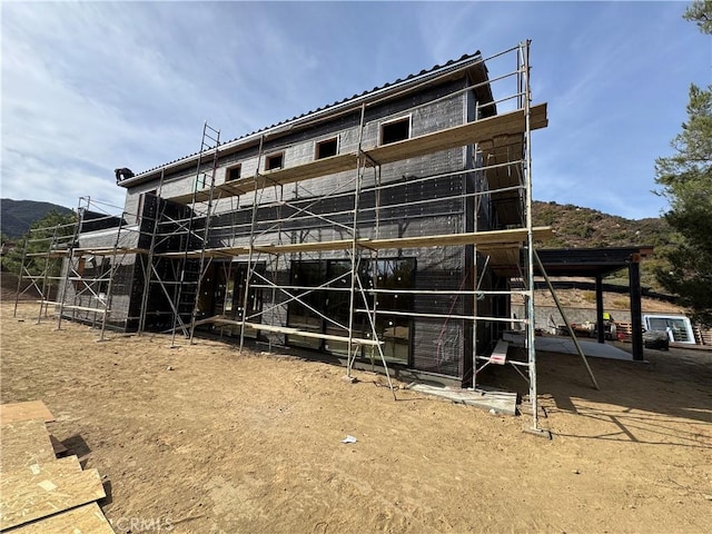 exterior space featuring a mountain view