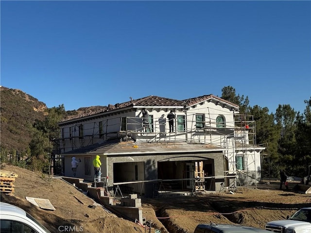 rear view of house with a mountain view