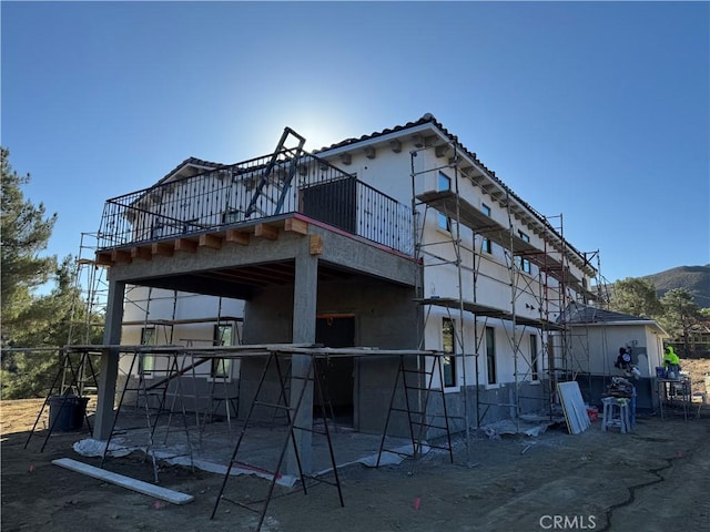 view of side of home featuring a mountain view