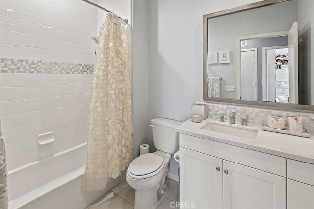 full bathroom with tile patterned flooring, toilet, shower / bath combo, decorative backsplash, and vanity