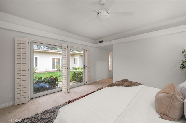 bedroom featuring light carpet, access to outside, and ceiling fan