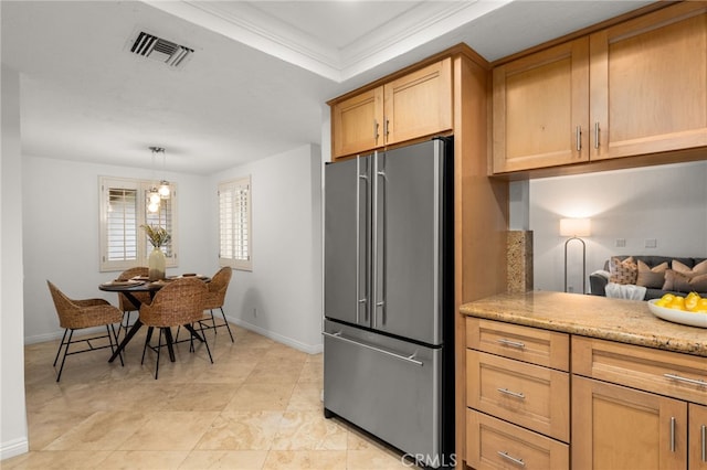 kitchen featuring decorative light fixtures and high end refrigerator