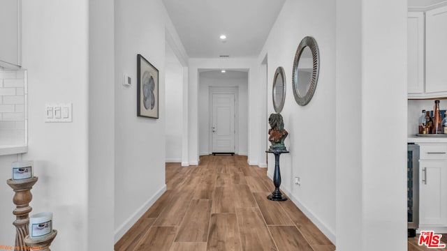 hall with light hardwood / wood-style flooring