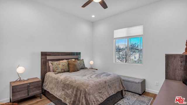 bedroom featuring light hardwood / wood-style floors and ceiling fan