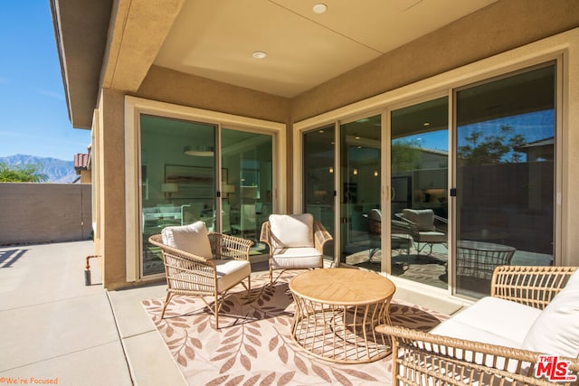 view of patio / terrace featuring a mountain view