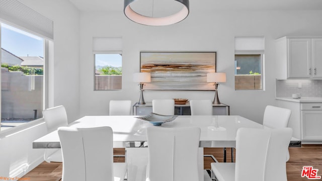 dining area with light hardwood / wood-style flooring