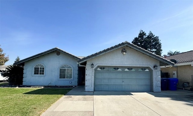 single story home featuring a garage and a front lawn