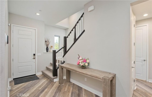 entrance foyer with hardwood / wood-style floors