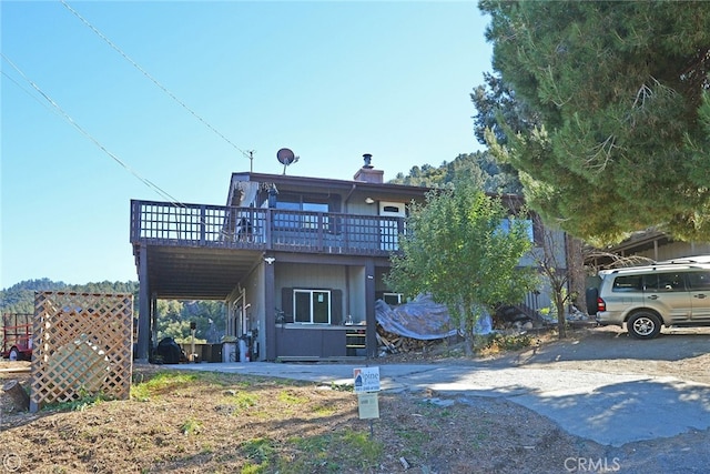 view of front of home featuring a wooden deck