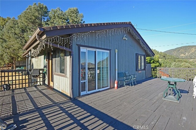 wooden terrace featuring a mountain view