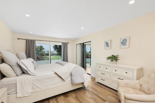 bedroom featuring light hardwood / wood-style floors and access to exterior