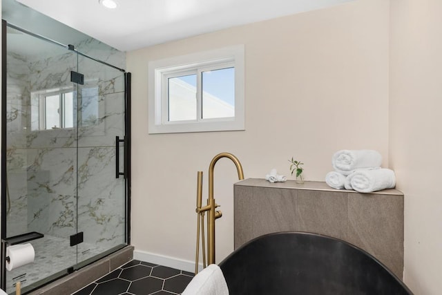 bathroom featuring tile patterned flooring and a shower with door