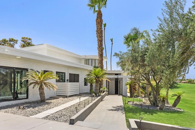 view of front of home with a front yard