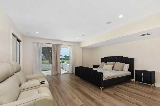 bedroom featuring access to outside and wood-type flooring