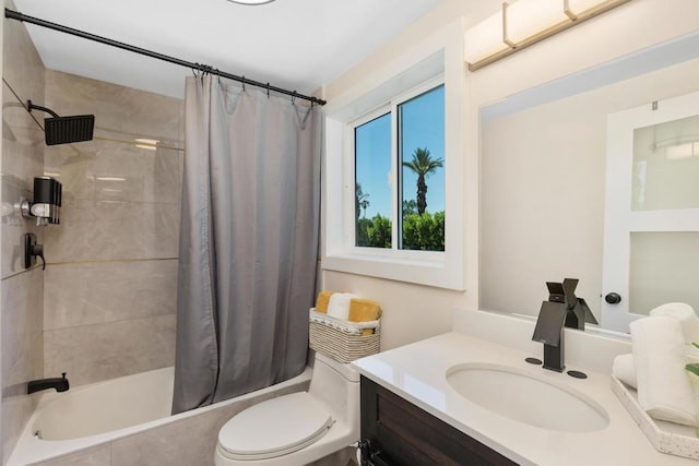 full bathroom featuring shower / bath combo, vanity, and toilet