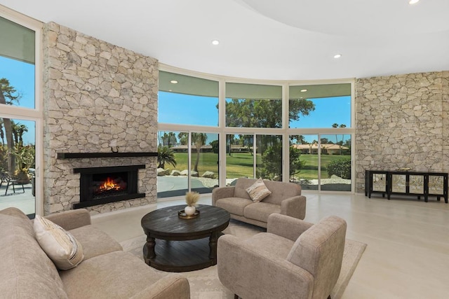 living room featuring a fireplace and a wealth of natural light