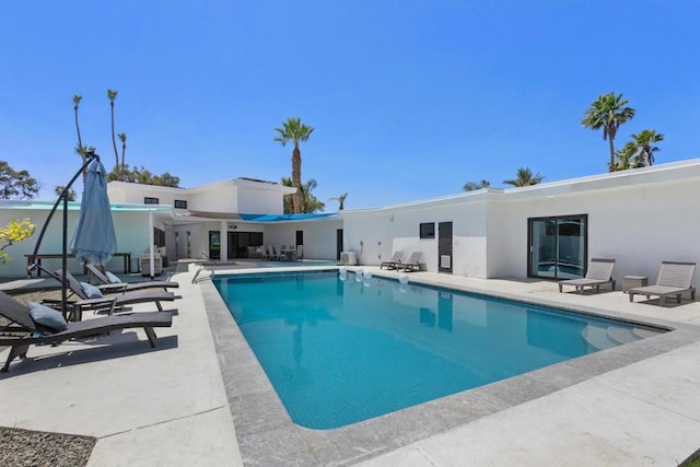 view of swimming pool featuring a patio