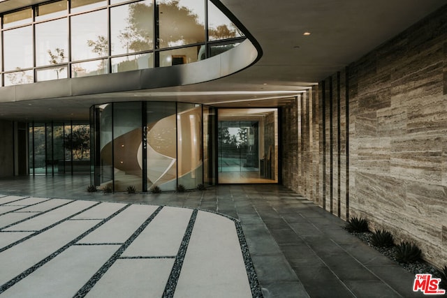 entrance to property featuring a patio