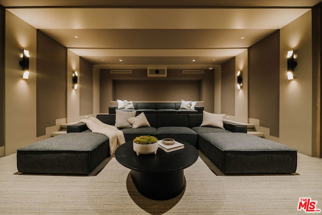 home theater room with light carpet