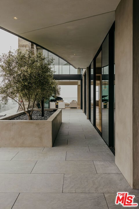 corridor featuring expansive windows