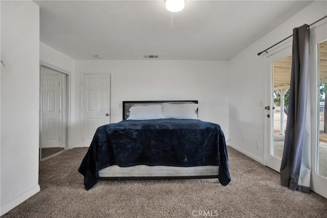 carpeted bedroom with access to exterior, baseboards, and visible vents